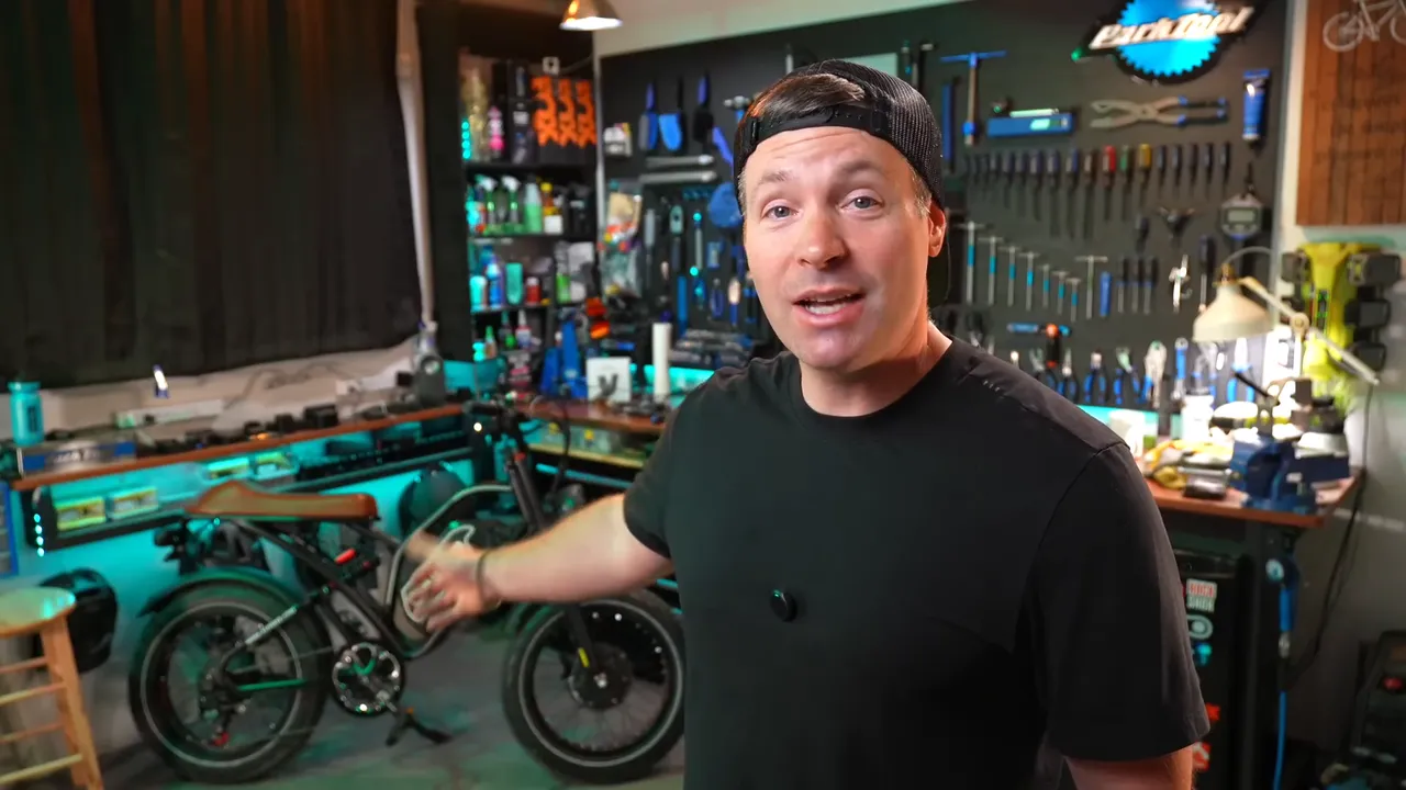 Ben, 5'9", beside the Euybike S4 Pro in his studio