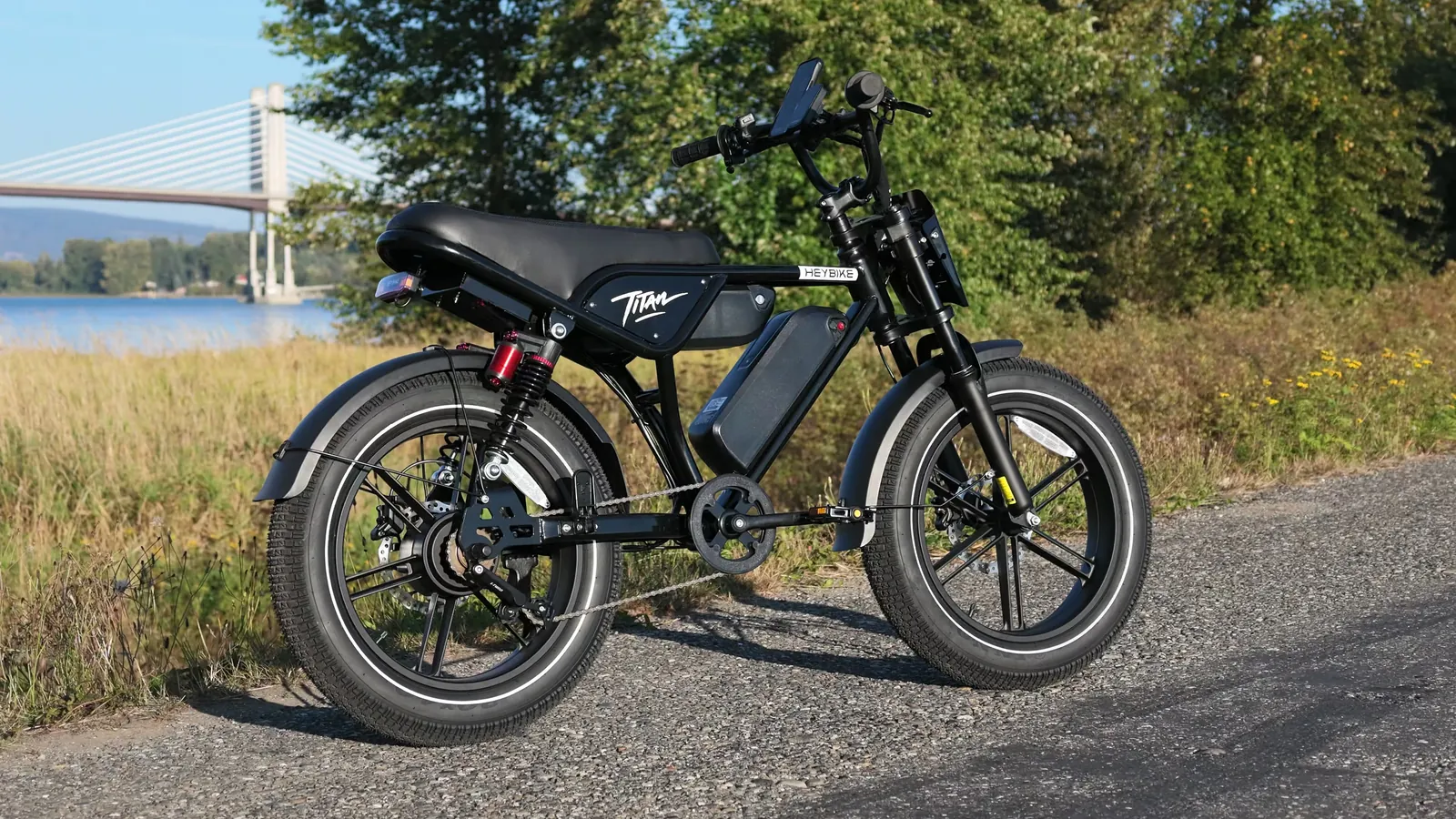 Heybike Titan parked on a gravel path near a bridge