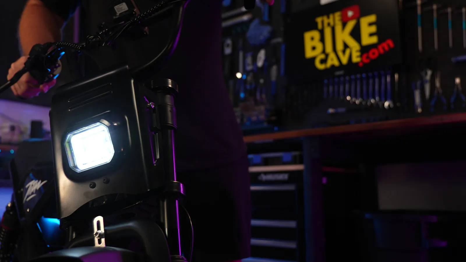 Heybike Titan square LED headlight switched on in the studio