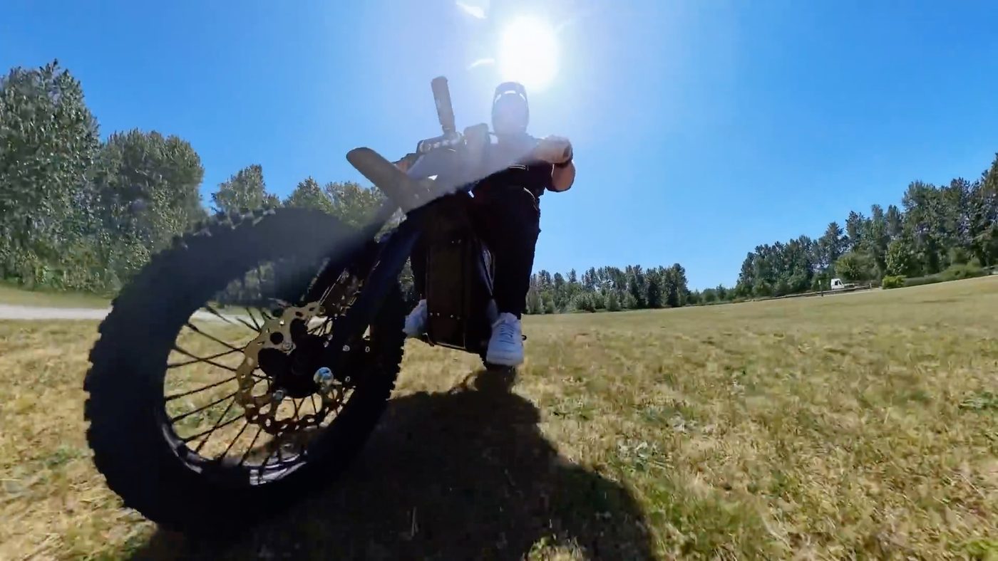 Front wheel of the Heybike Villain lifting on a field track