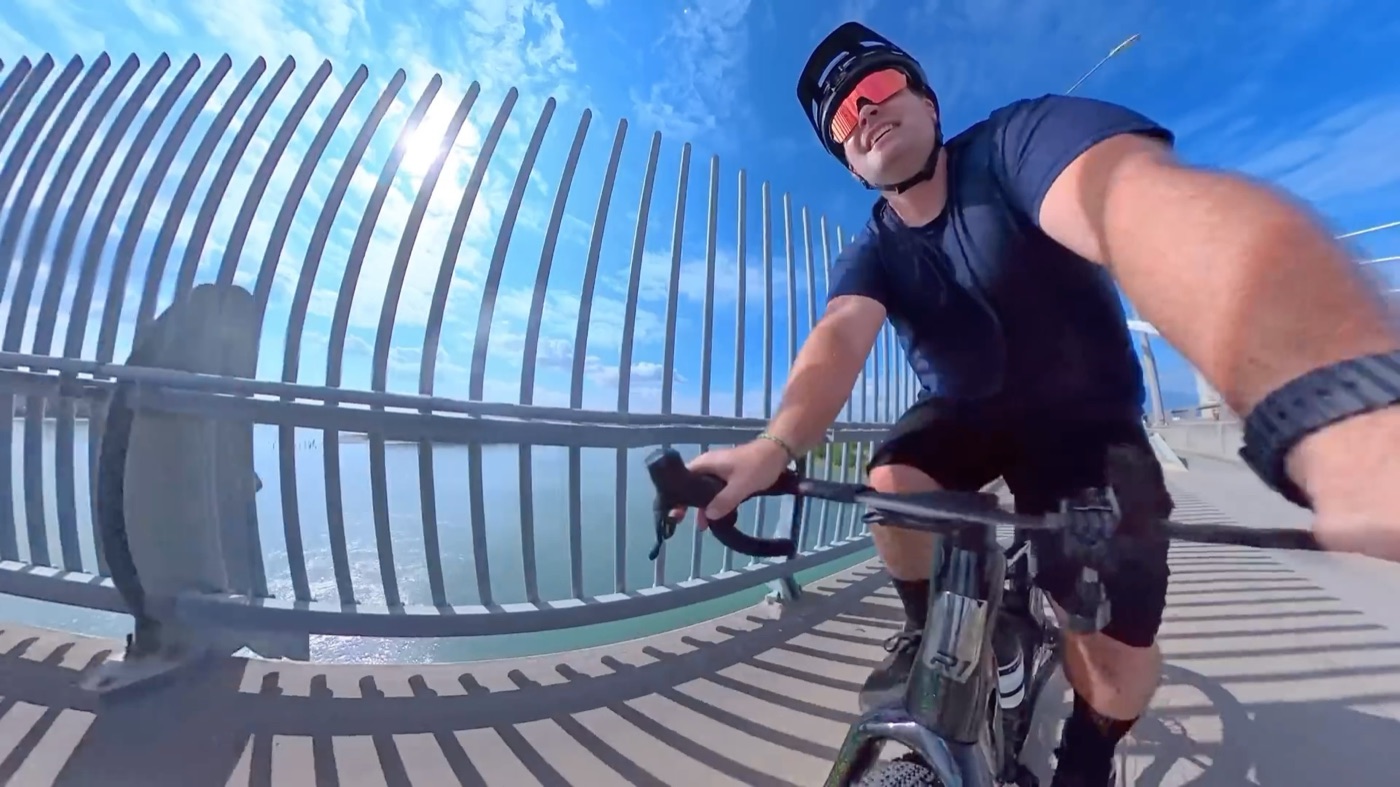 Riding the CF Racer1 across a bridge on the group road ride