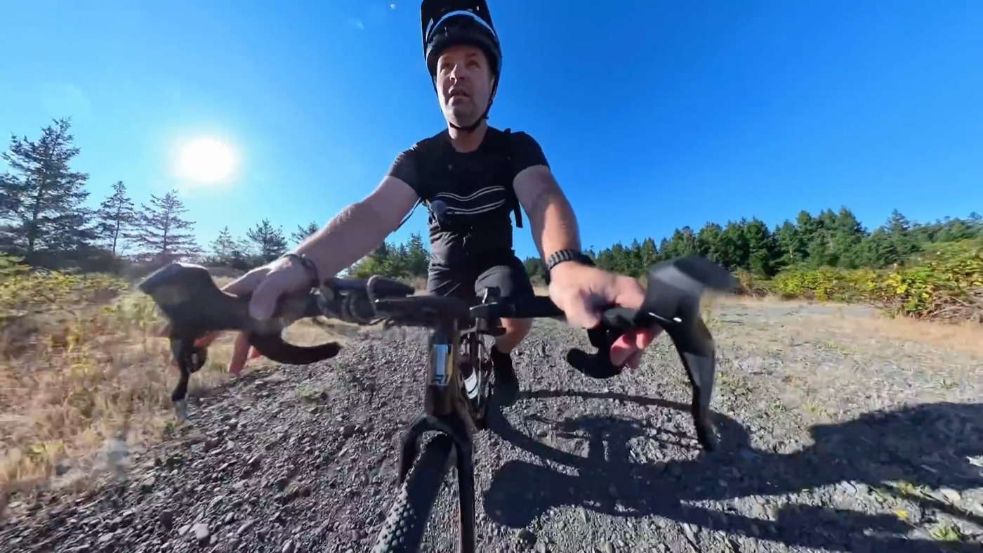 Riding the CF Racer1 on a coastal gravel trail