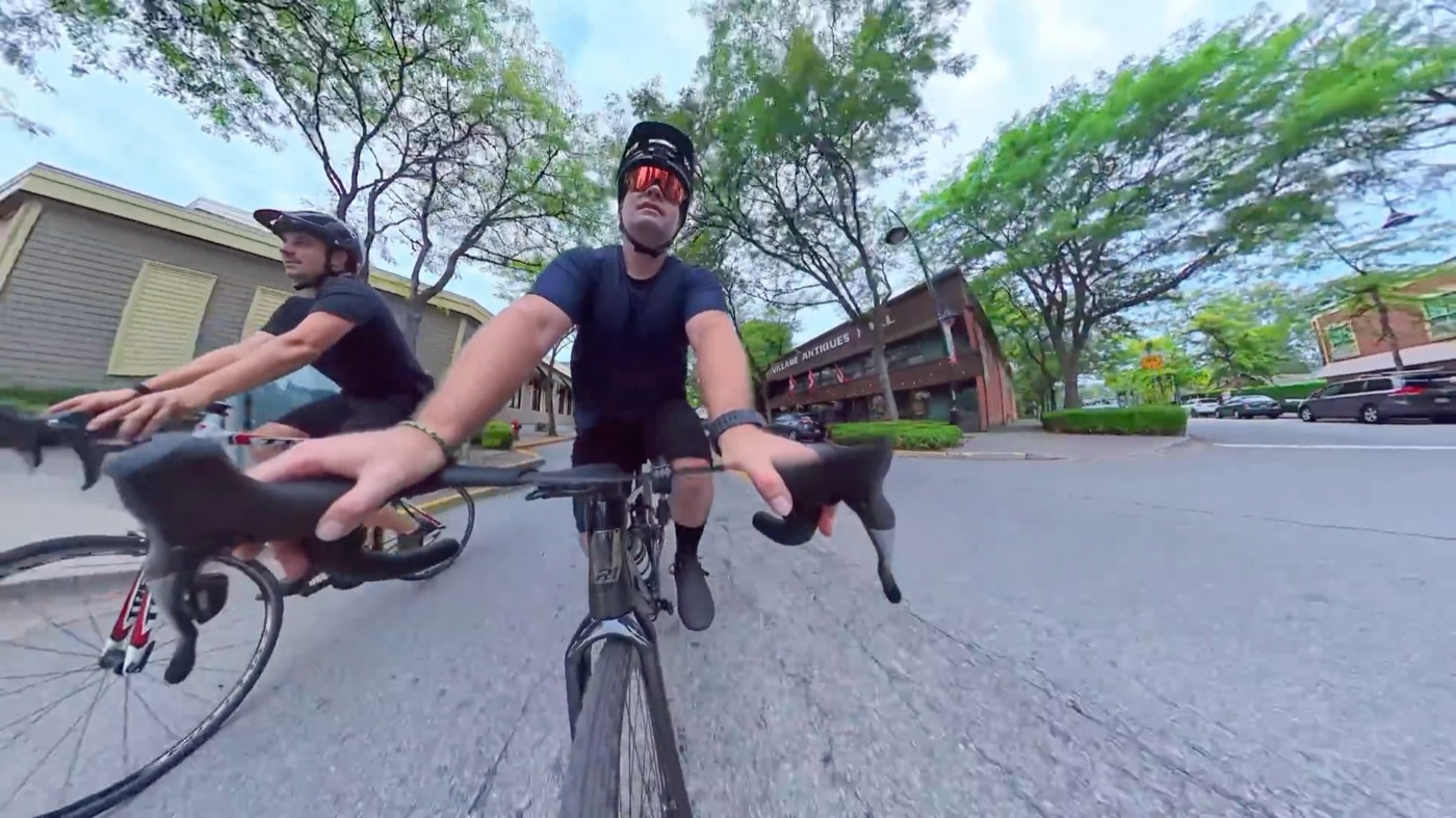 Riding the CF Racer1 alongside another rider on the road