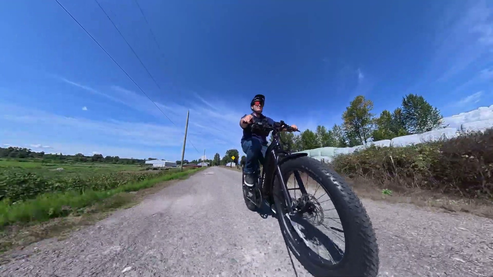 Ben riding the Explorer Plus iQ down a gravel road