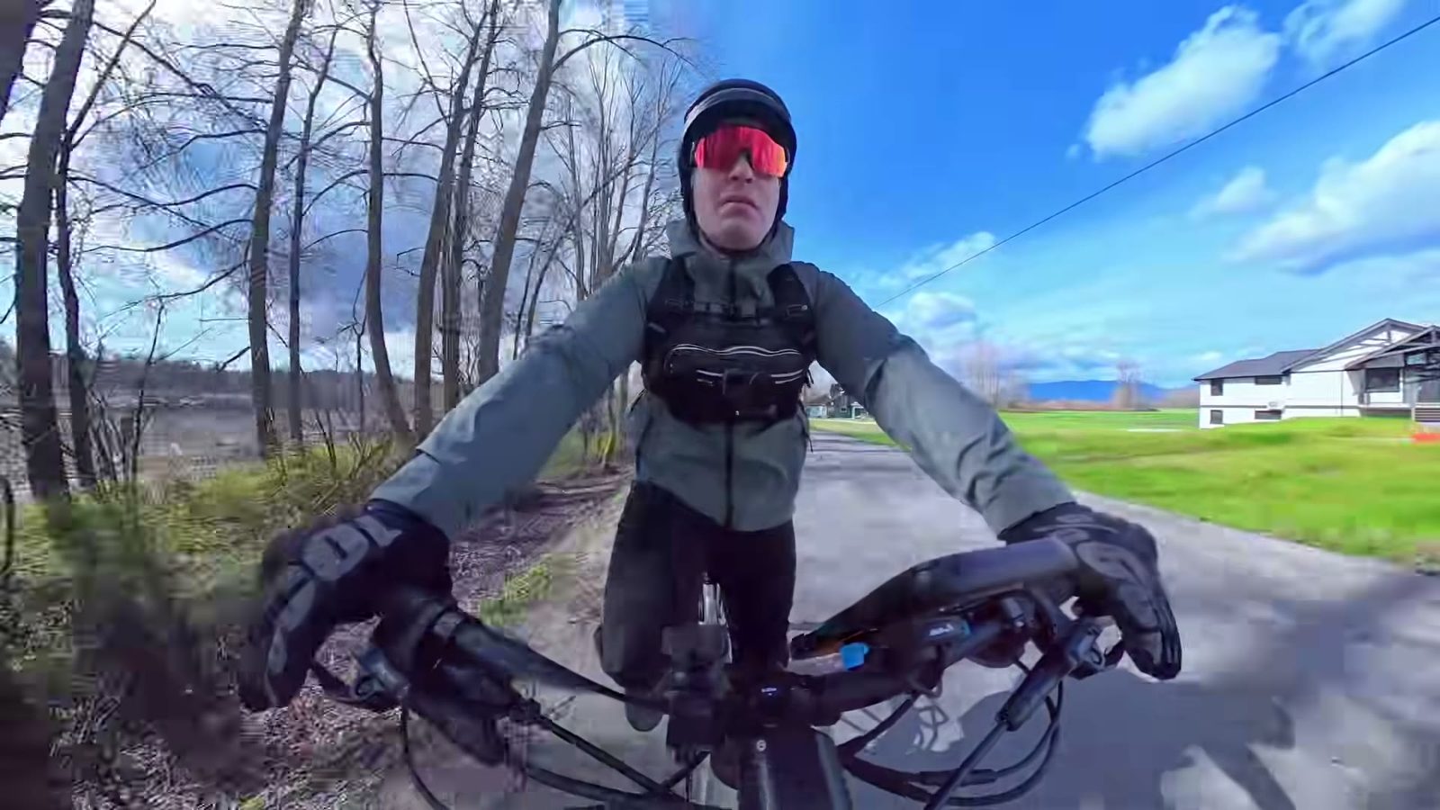 Ben riding the Tempo toward the camera on a tree-lined trail after the top speed run