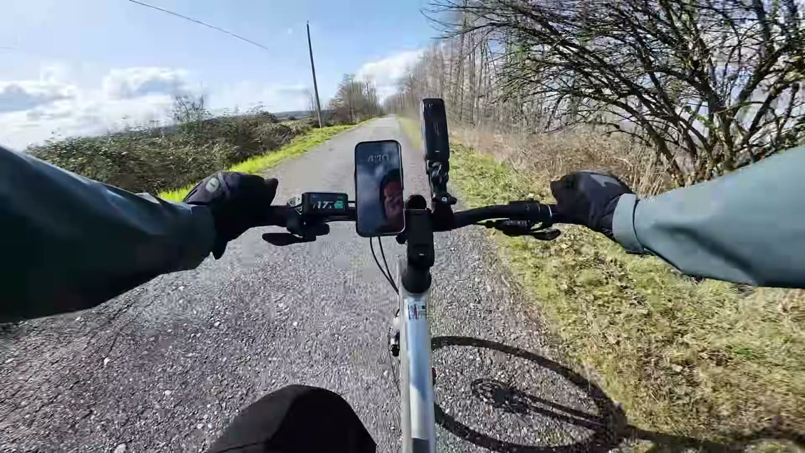 Rider point of view over the Tempo handlebars on a gravel path