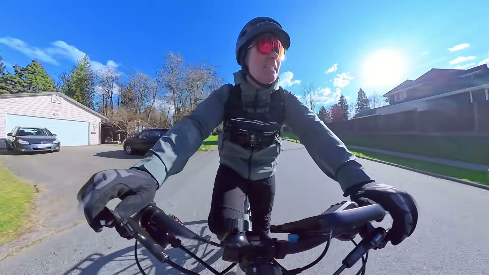 Ben riding the Tempo on a sunny suburban street near the end of the range check