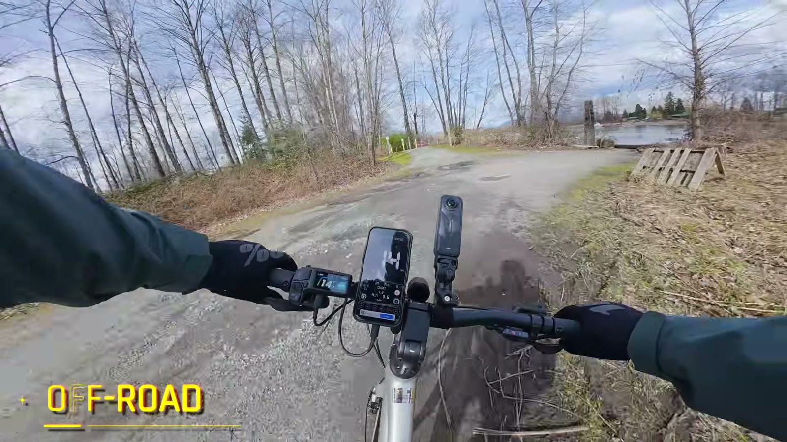 Point of view riding the Tempo over a rough gravel lot by the water