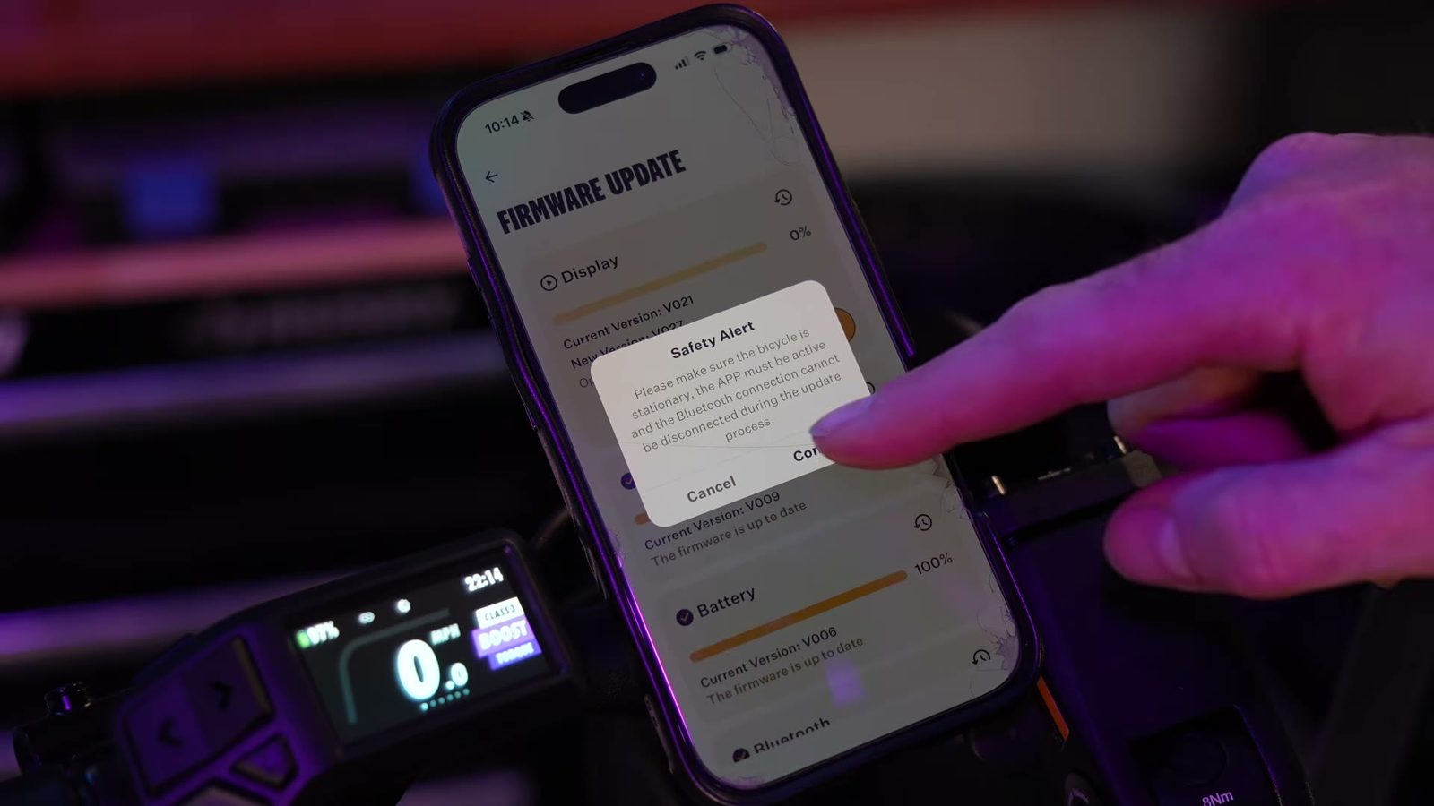 Phone in hand running an over-the-air firmware update for the Tempo
