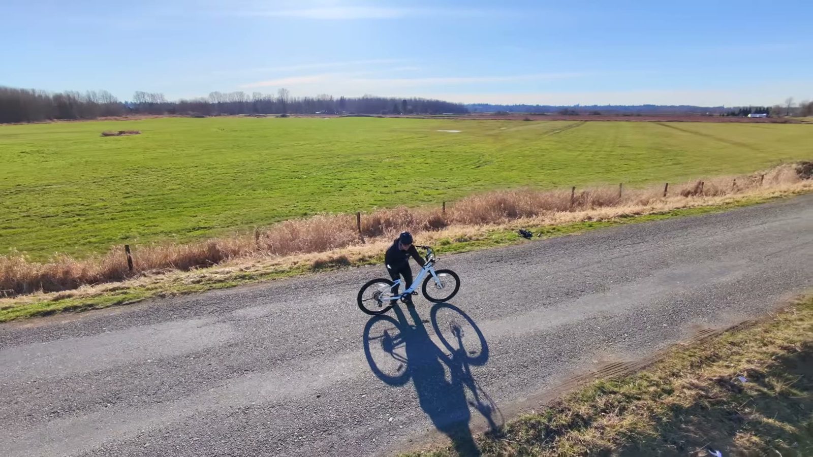Ben lining up the Satin White Velotric Breeze 1 on a gravel road beside open farmland