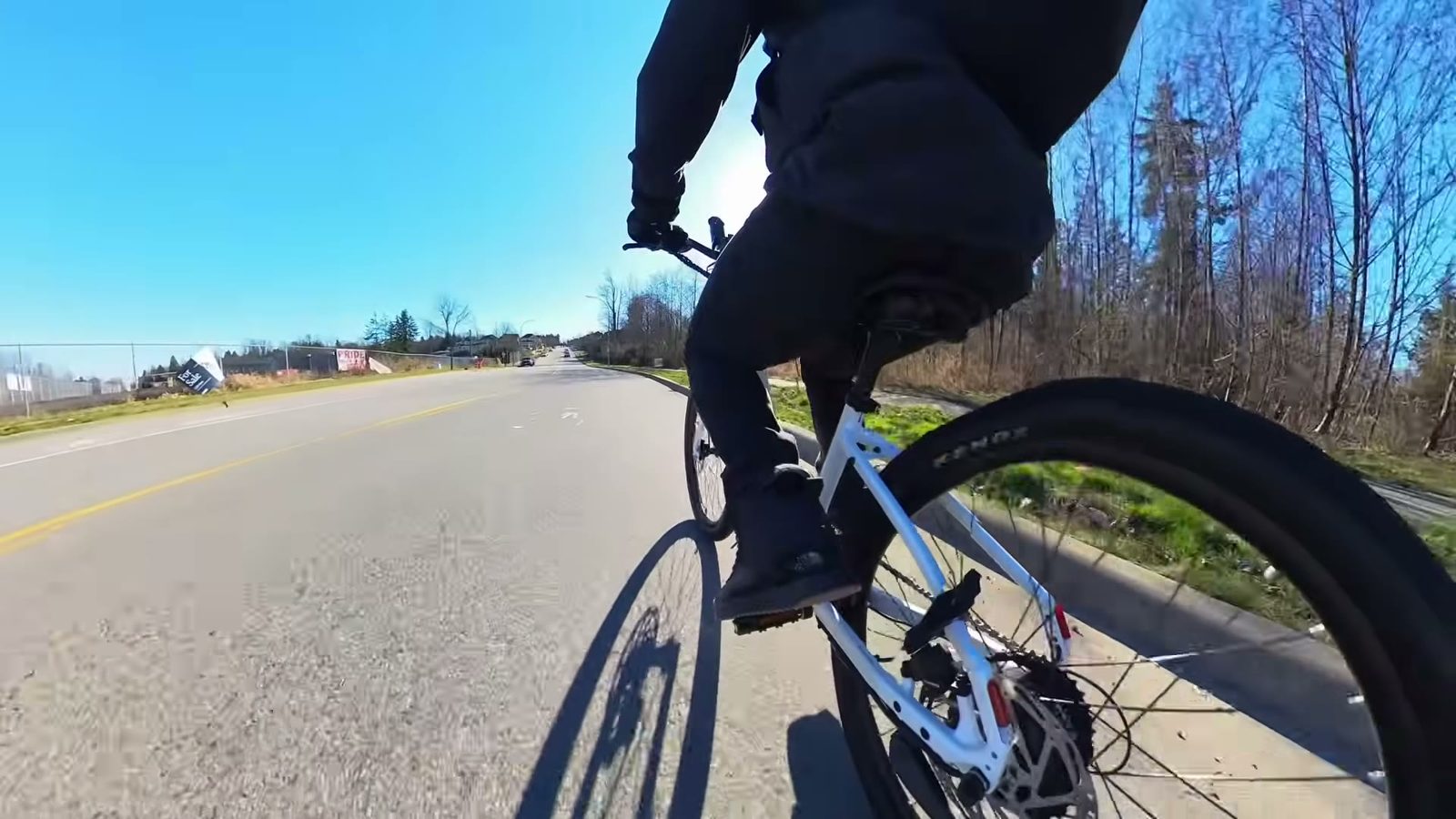 Rear wheel of the Breeze 1 showing the hub motor, disc rotor and Kenda tire while riding