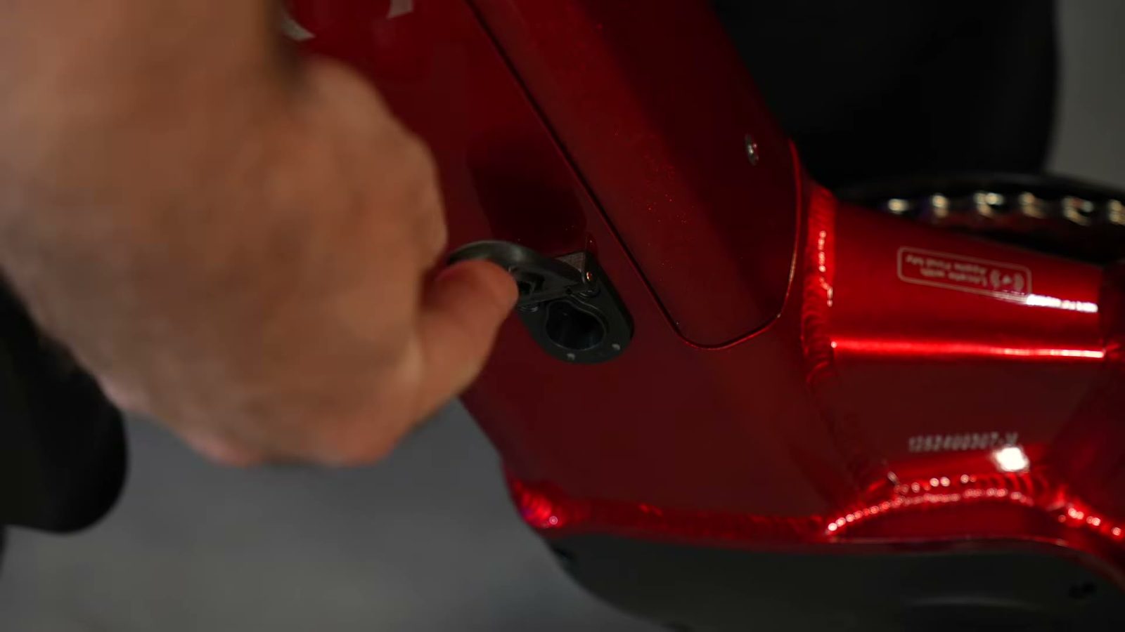 Spring-loaded magnetic charge port cover on the Discover 2