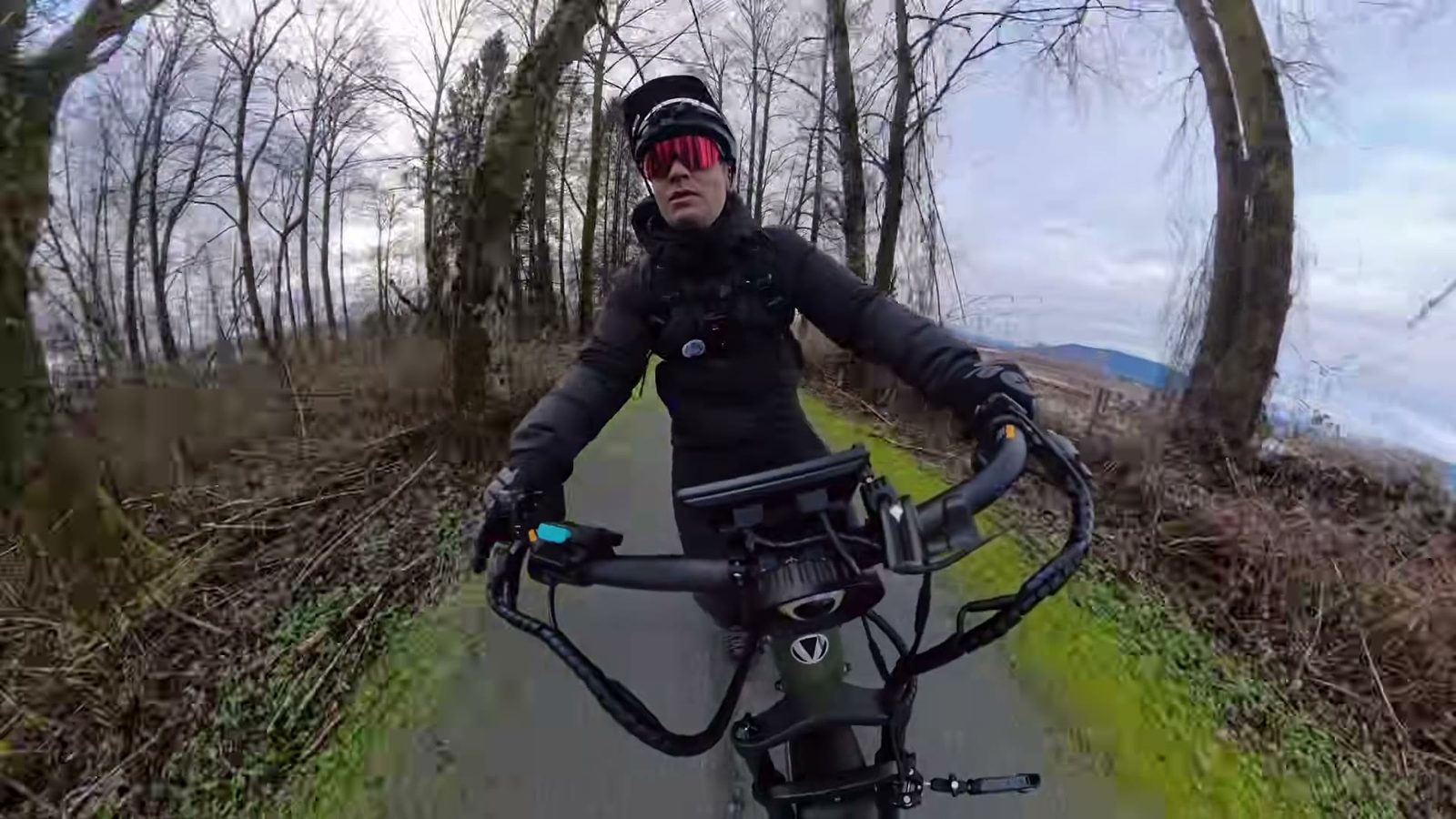 Ben riding the Nomad 2 down a mossy tree-lined path
