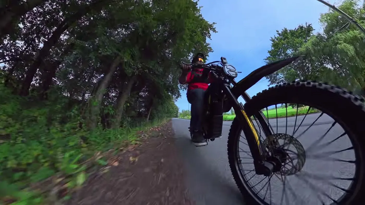 Zonveer ZX3: low angle of Ben riding on pavement