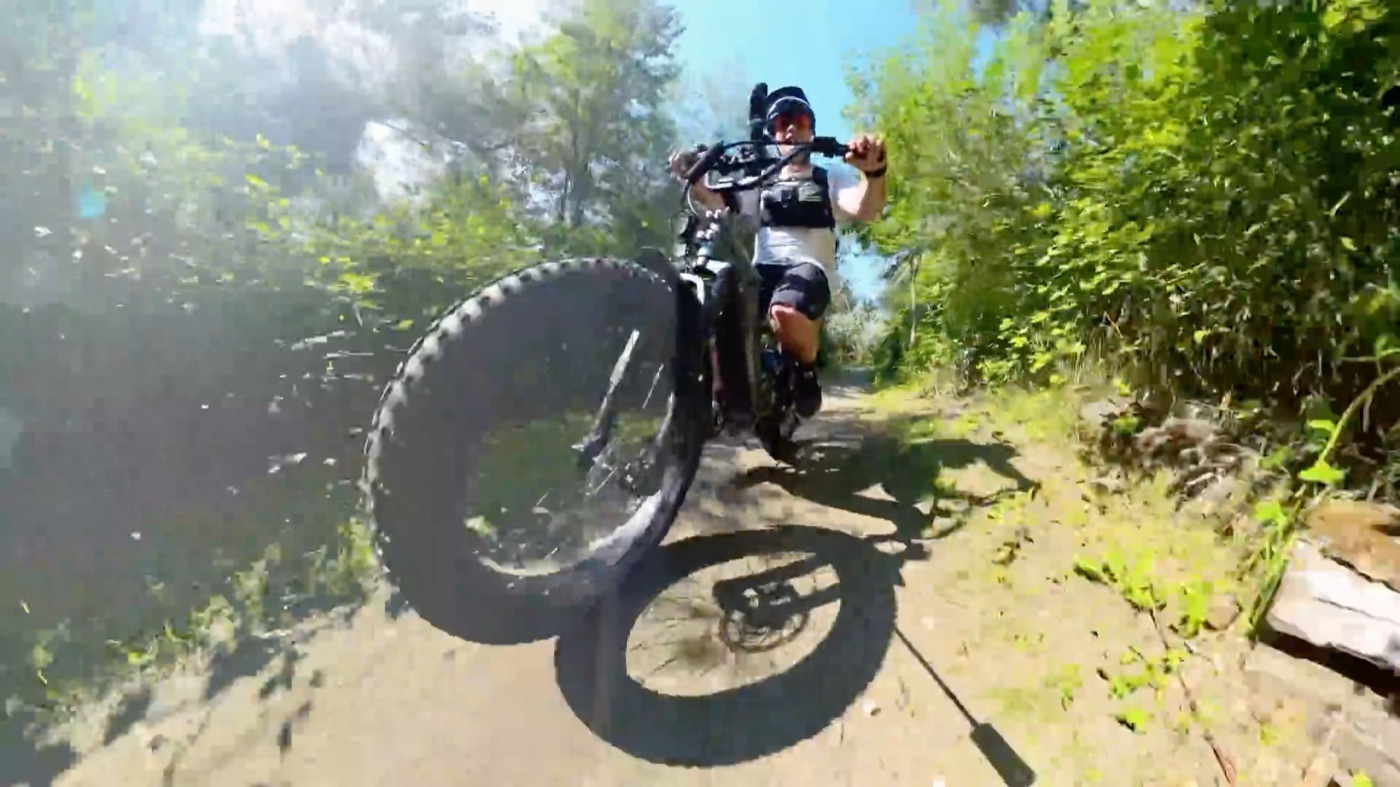 Front wheel lifting on a loose dirt trail
