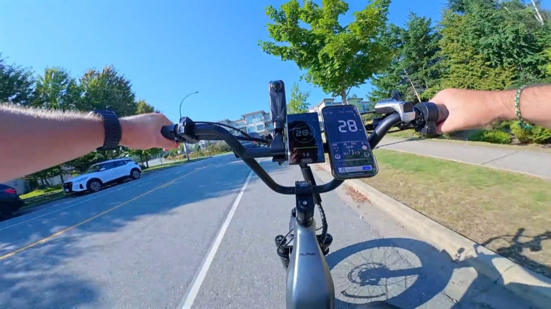 POV riding uphill with the display showing 28 mph