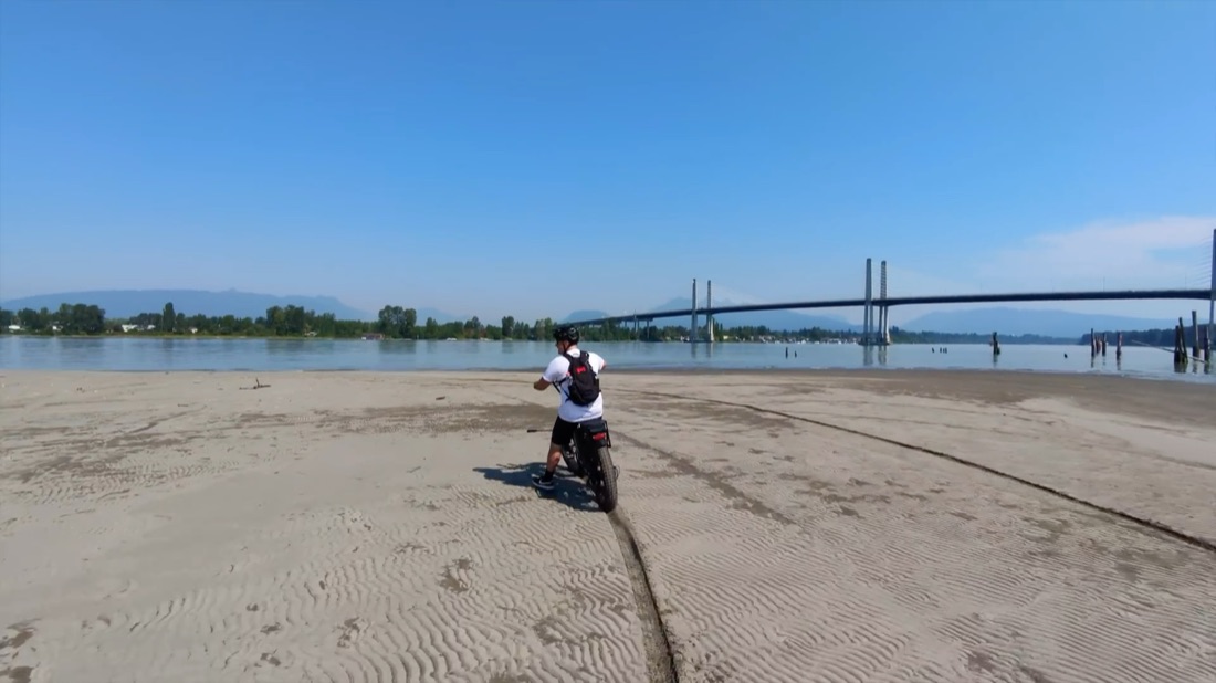 Riding the Magician Alpha along a wide sand beach