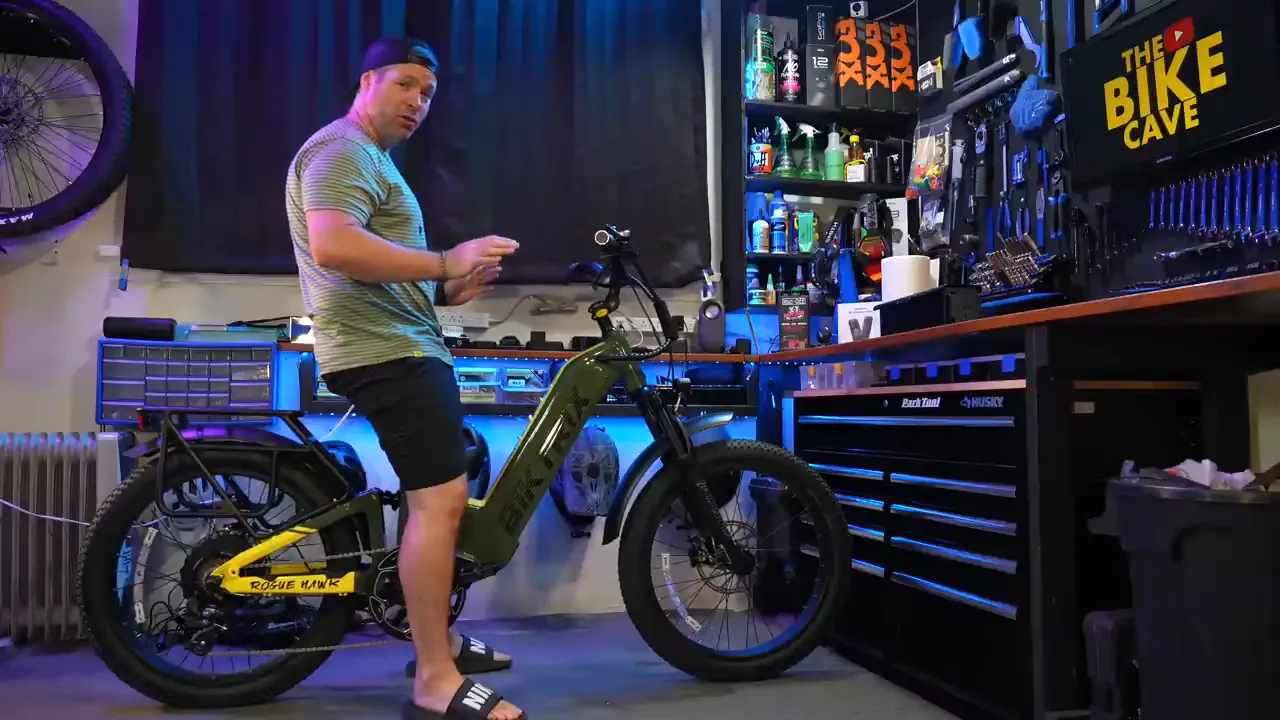 Ben, 5'9", sitting on the Biktrix Rogue Hawk in his studio