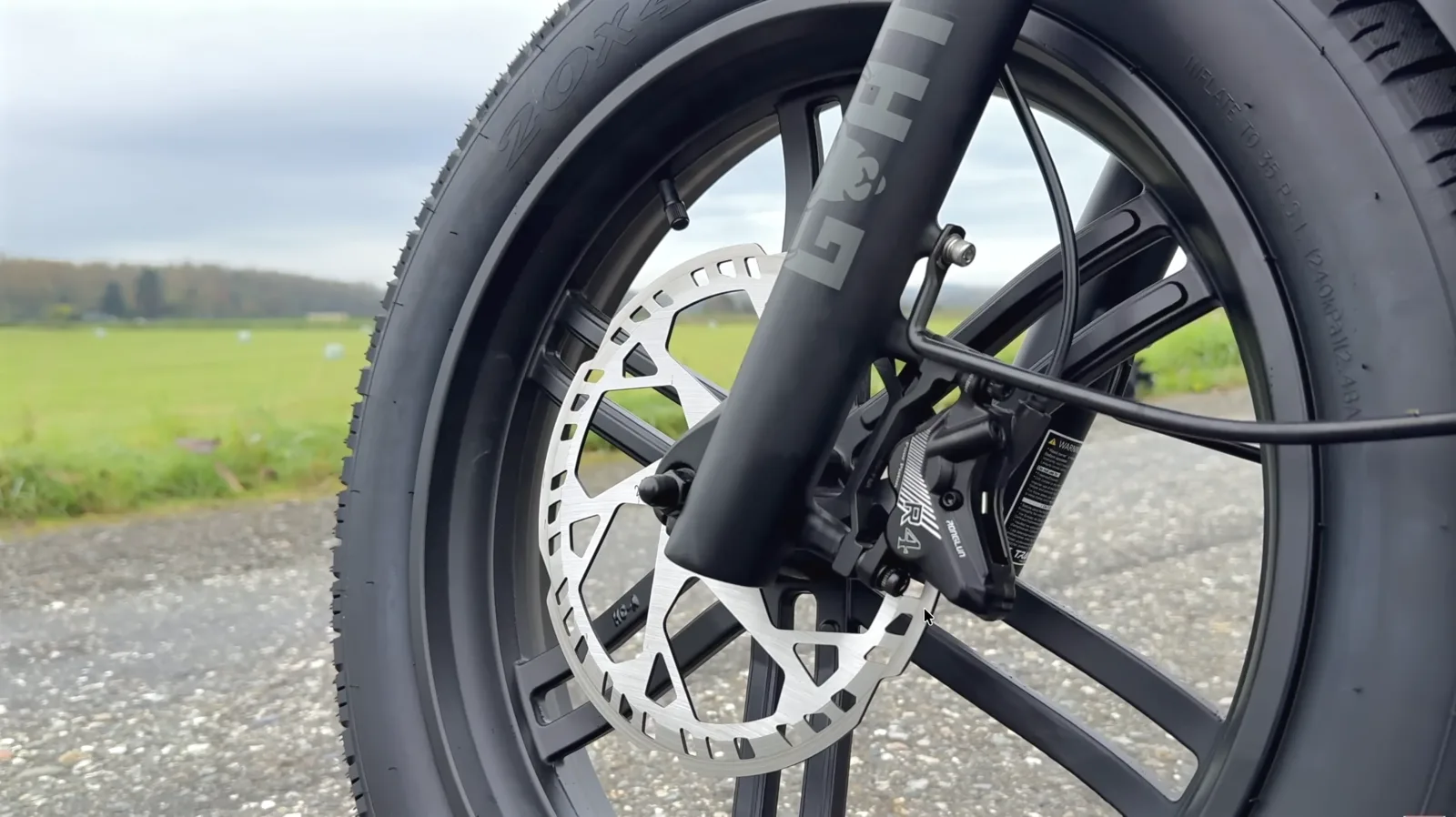 Front brake caliper and rotor