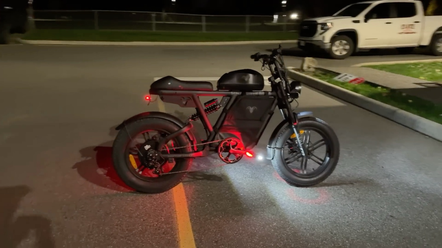 Motor Goat lit up at night in a parking lot