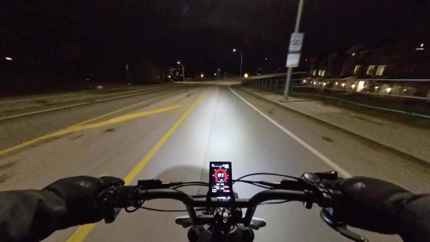 Motor Goat headlight beam on a dark road