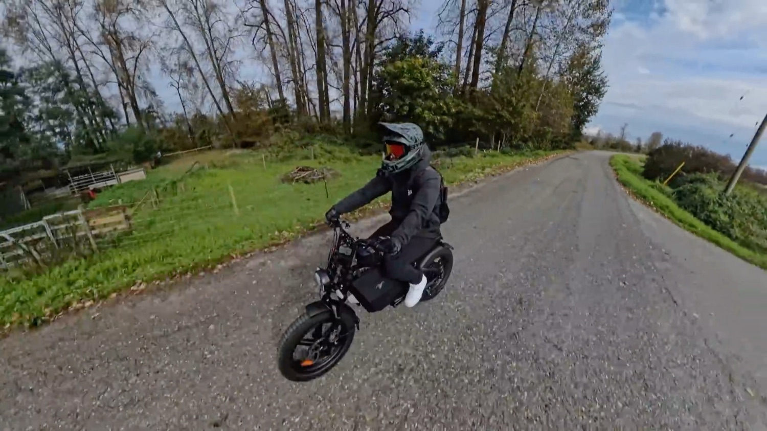 Riding the Motor Goat along a gravel dyke road