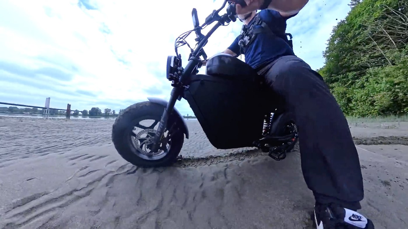 Mini Goat accelerating across wet beach sand